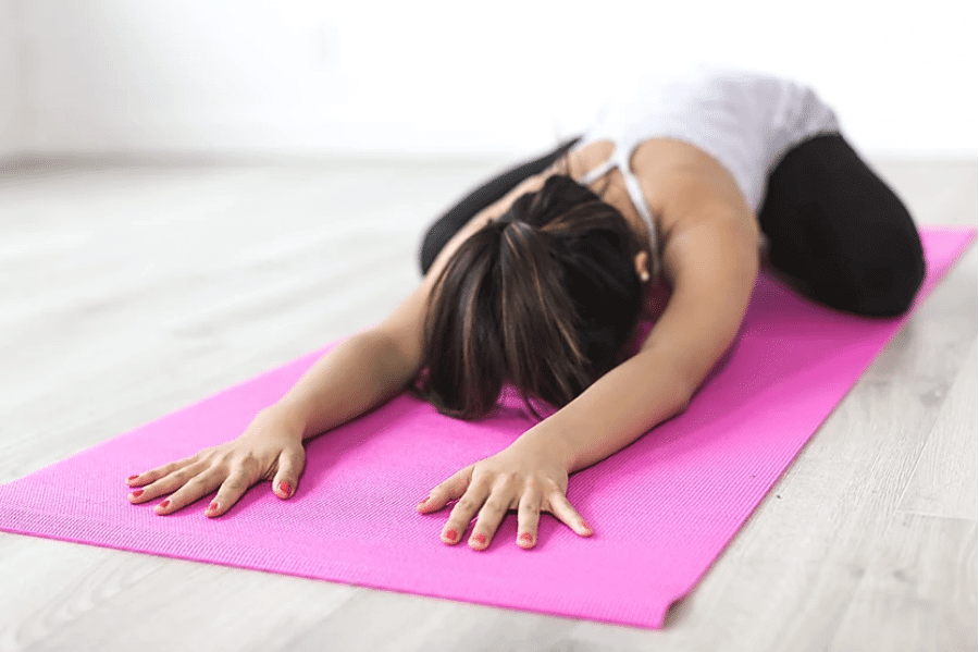 Cycle Syncing Menstruation phase woman-doing-yoga