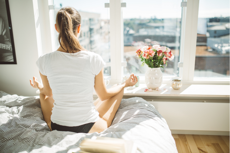 Woman in Bed Fertility Meditation