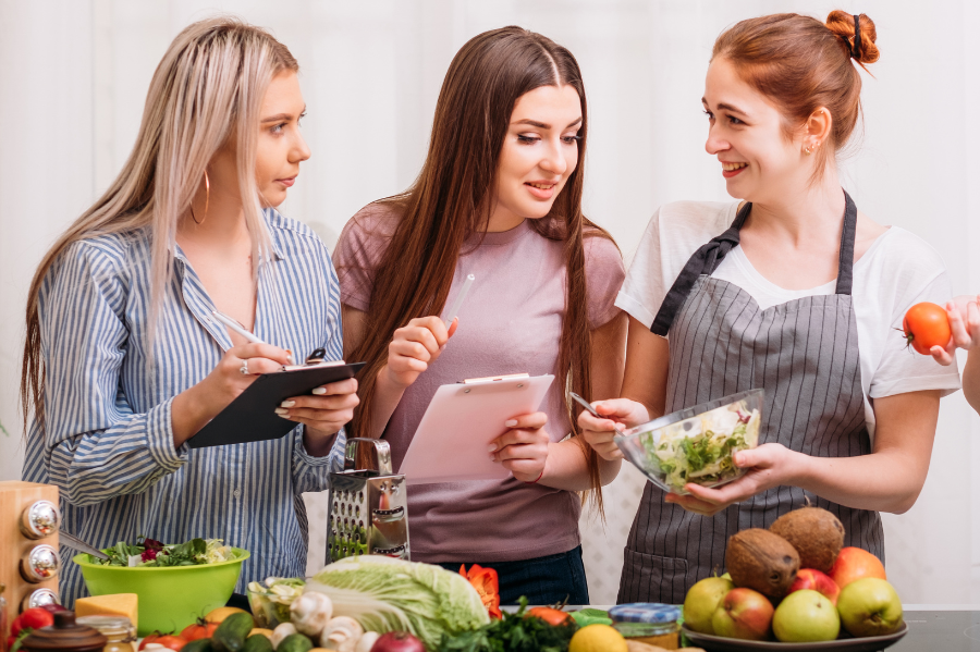 females in kitchen planning food full of nutrition