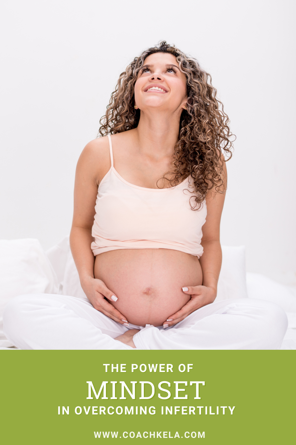 pregnant woman with a positive mindset holding her belly