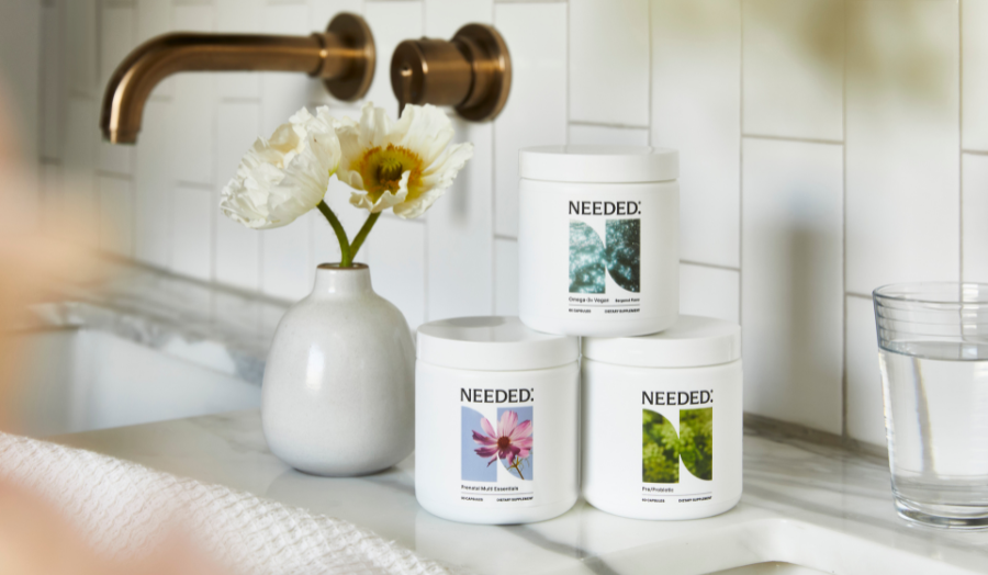 Needed prenatal and supplement jars displayed on a bathroom shelf