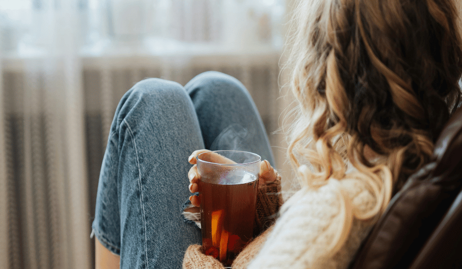 Woman coping with pregnancy after miscarriage anxiety in a calm home setting